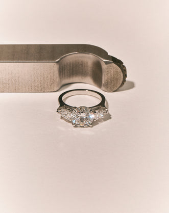 Cornelia Round Brilliant Pear Side Stone Engagement Ring