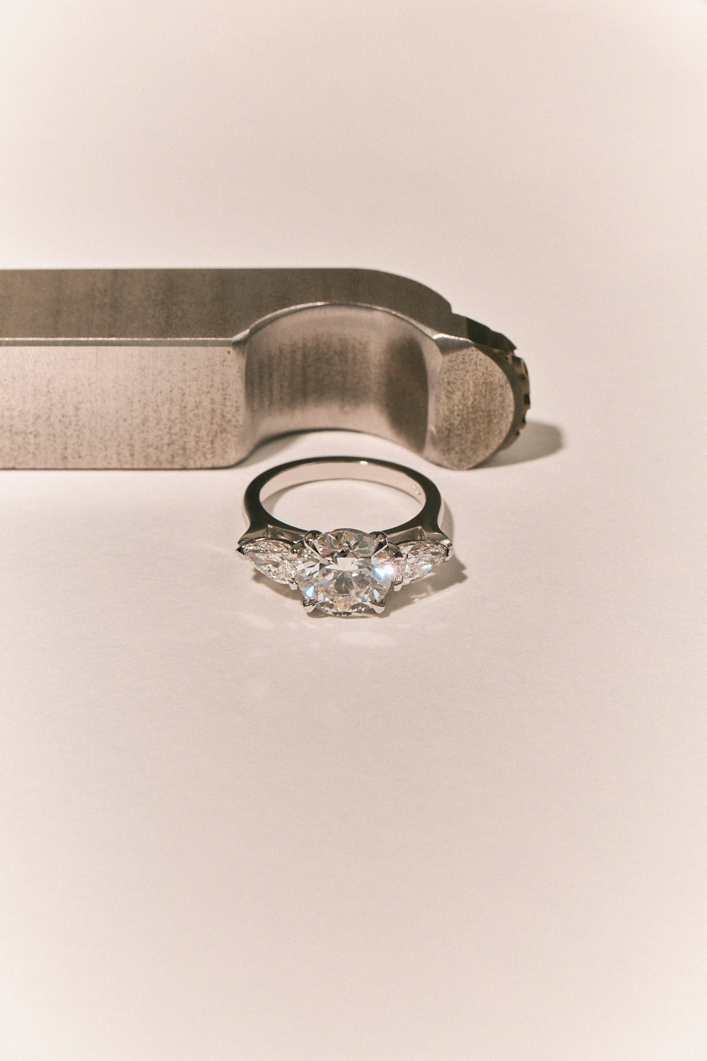 Cornelia Round Brilliant Pear Side Stone Engagement Ring