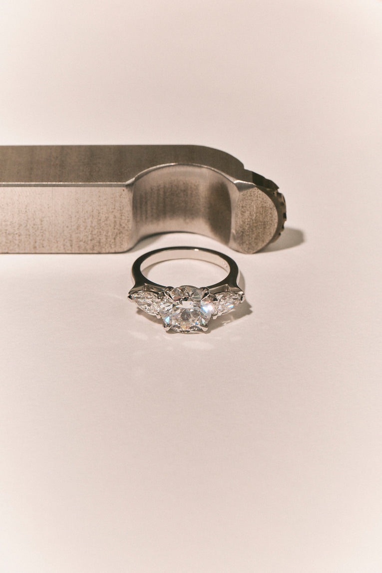 Cornelia Round Brilliant Pear Side Stone Engagement Ring