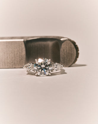 Cornelia Round Brilliant Pear Side Stone Engagement Ring