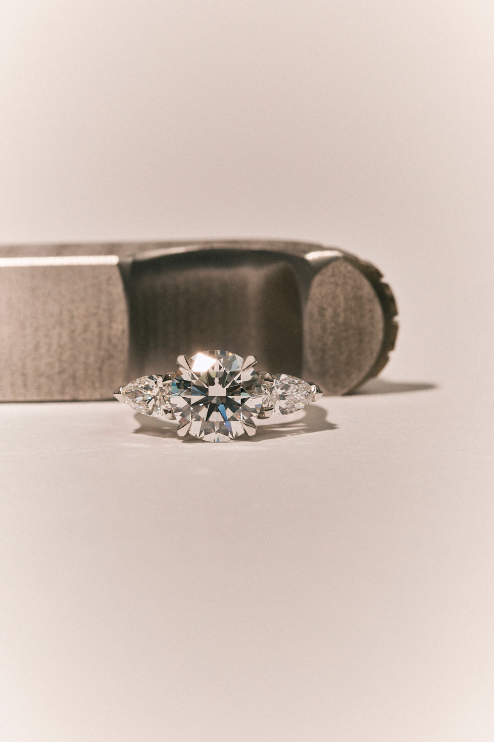 Cornelia Round Brilliant Pear Side Stone Engagement Ring