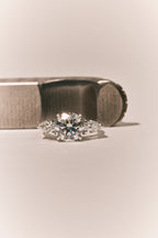 Cornelia Round Brilliant Pear Side Stone Engagement Ring