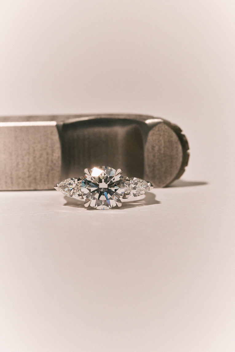 Cornelia Round Brilliant Pear Side Stone Engagement Ring
