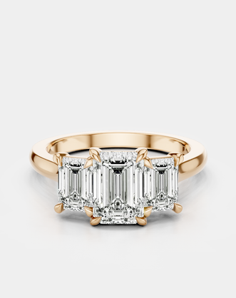 Marion emerald cut trilogy engagement ring in 18ct rose gold