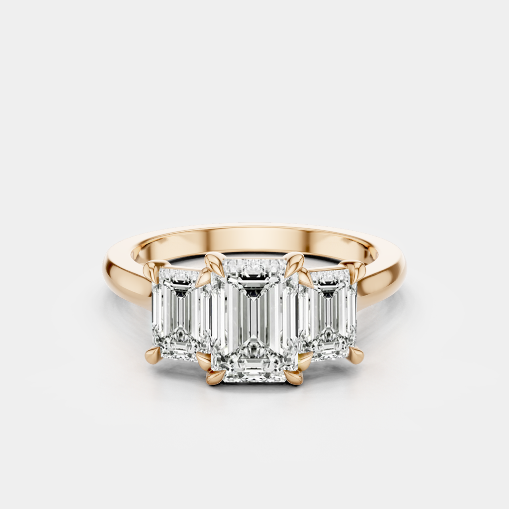 Marion emerald cut trilogy engagement ring in 18ct rose gold