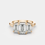 Marion emerald cut trilogy engagement ring in 18ct rose gold
