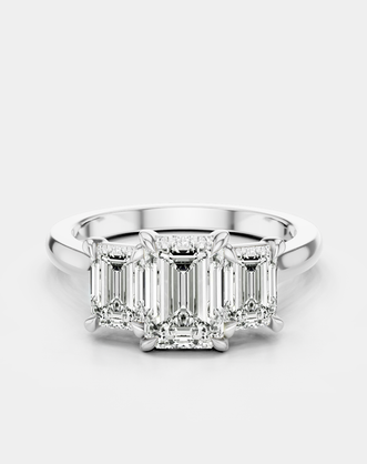 Marion emerald cut trilogy engagement ring in platinum