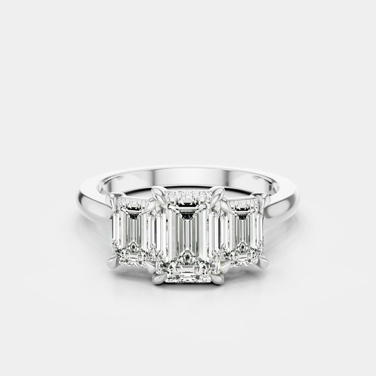 Marion emerald cut trilogy engagement ring in platinum