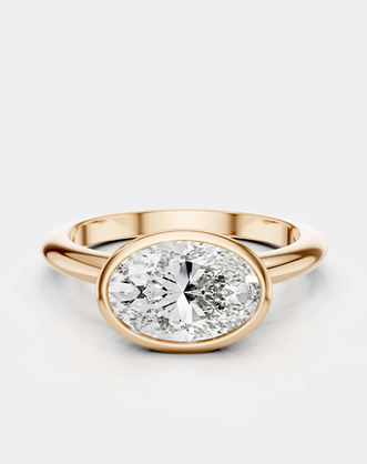 Maddox oval solitaire bezel east-west engagement ring in 18ct rose gold