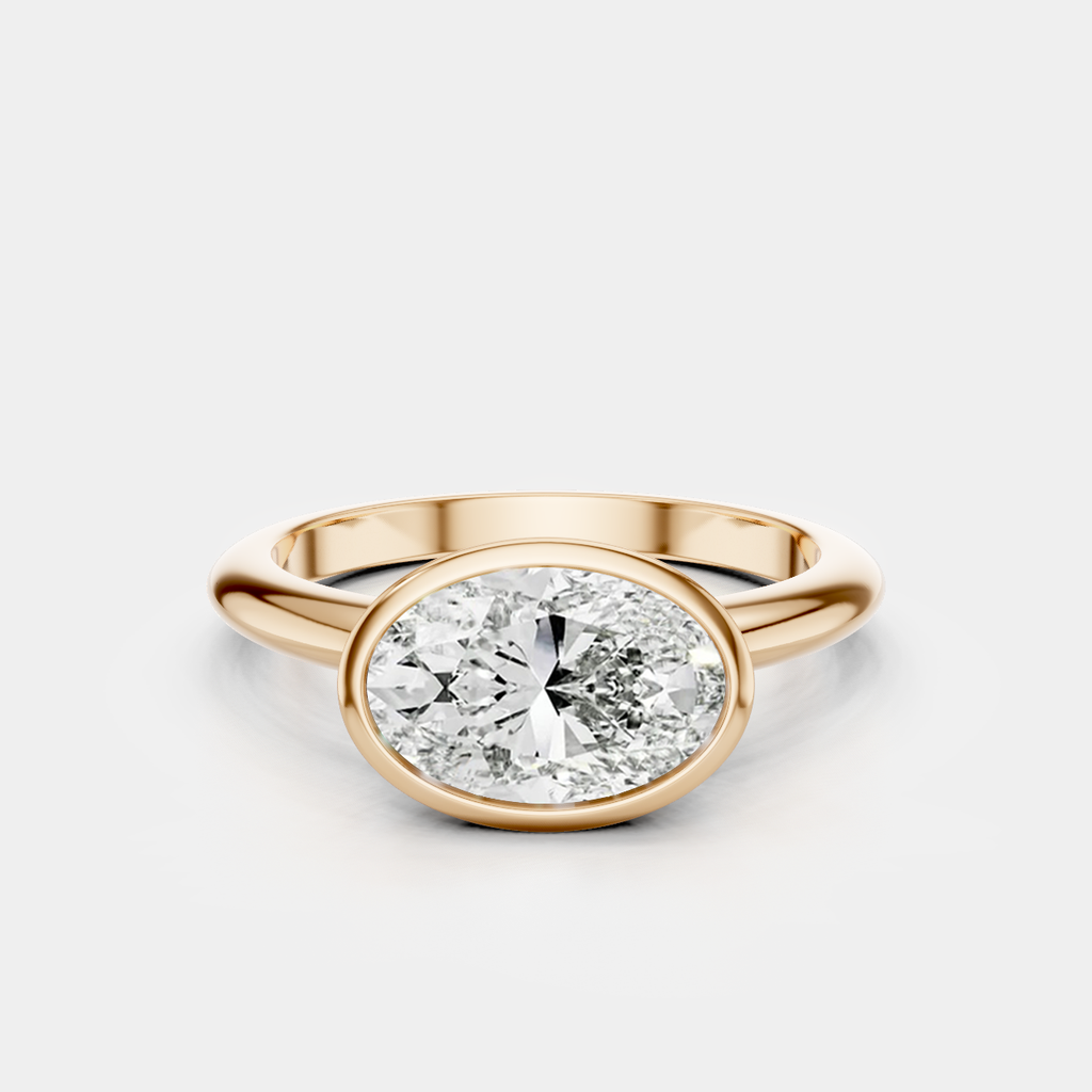Maddox oval solitaire bezel east-west engagement ring in 18ct rose gold