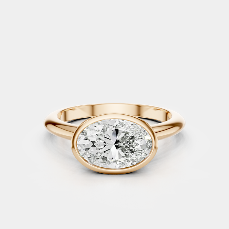 Maddox oval solitaire bezel east-west engagement ring in 18ct rose gold