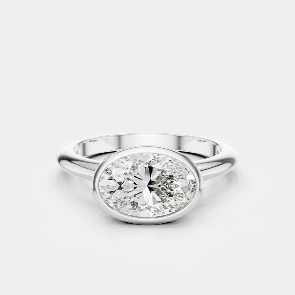 Maddox oval solitaire bezel east-west engagement ring in 18ct white gold