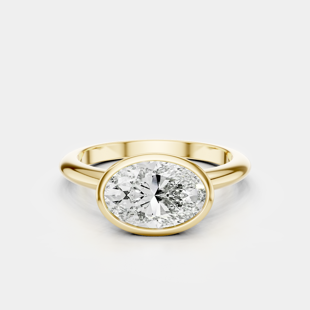 Maddox oval solitaire bezel east-west engagement ring in 18ct yellow gold