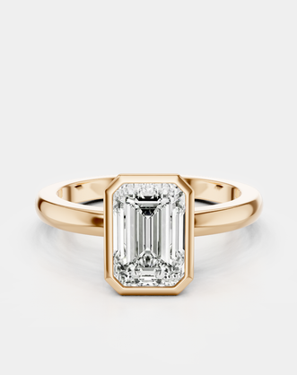 Sutton emerald cut solitaire bezel north-south engagement ring in 18ct rose gold