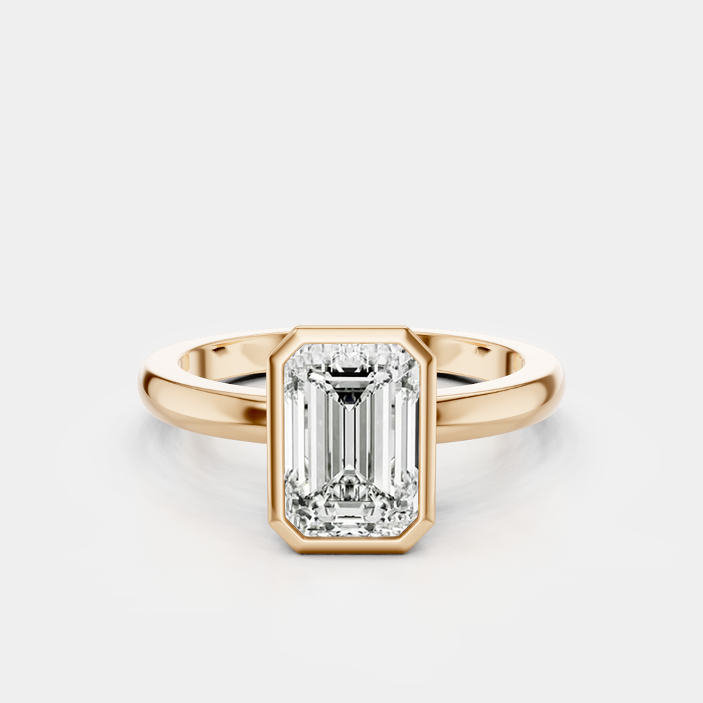 Sutton emerald cut solitaire bezel north-south engagement ring in 18ct rose gold