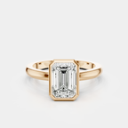 Sutton emerald cut solitaire bezel north-south engagement ring in 18ct rose gold