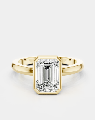 Sutton emerald cut solitaire bezel north-south engagement ring in 18ct yellow gold