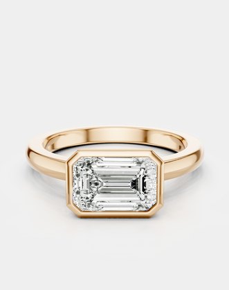 Rowan emerald cut solitaire bezel East-West engagement ring in 18ct rose gold
