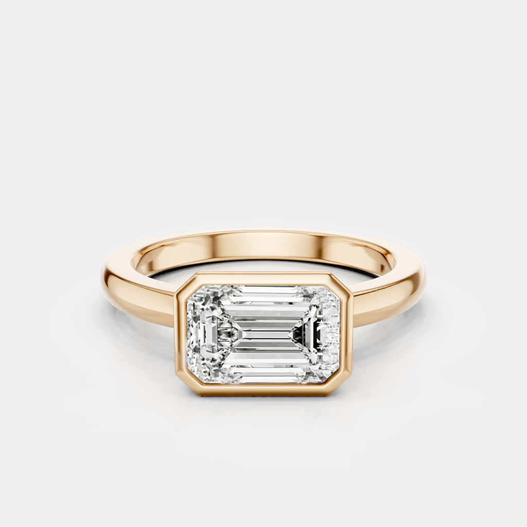 Rowan emerald cut solitaire bezel East-West engagement ring in 18ct rose gold