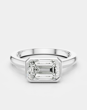 Rowan emerald cut solitaire bezel East-West engagement ring in 18ct white gold