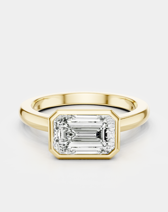 Rowan emerald cut solitaire bezel East-West engagement ring in 18ct yellow gold