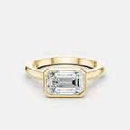 Rowan emerald cut solitaire bezel East-West engagement ring in 18ct yellow gold