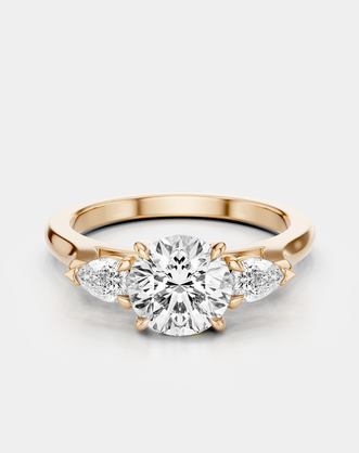 Cornelia round brilliant pear side stone engagement ring with lab-grown diamond band in 18ct rose gold