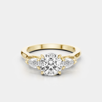 Cornelia round brilliant pear side stone engagement ring in 18ct yellow gold