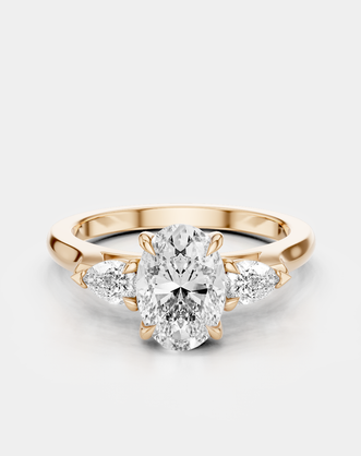 Bonaparte oval pear side stone engagement ring in 18ct rose gold