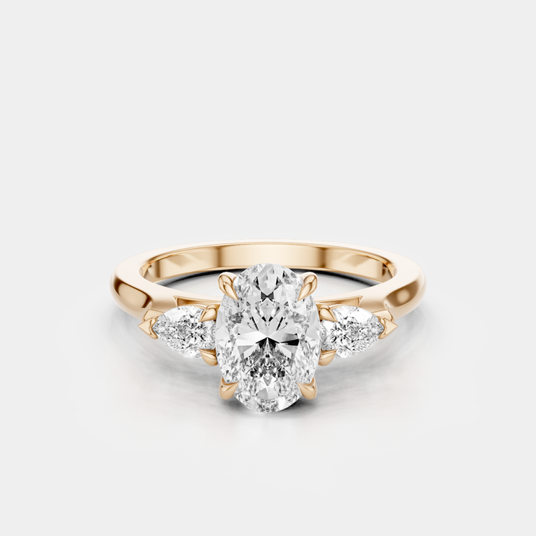 Bonaparte oval pear side stone engagement ring in 18ct rose gold