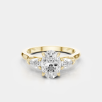 Bonaparte oval pear side stone engagement ring in 18ct yellow gold