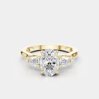 Bonaparte oval pear side stone engagement ring in 18ct yellow gold