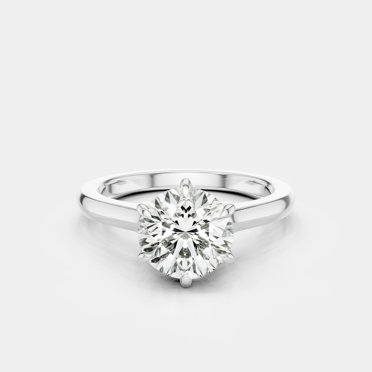 Cambon round brilliant six claw solitaire swept shoulder engagement ring in 18ct white gold