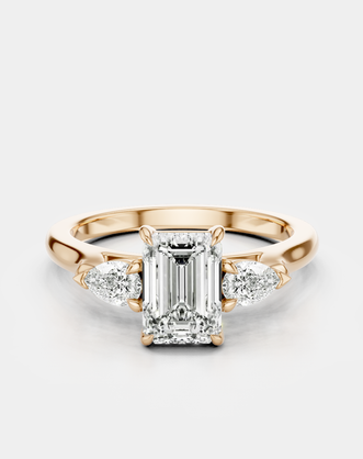 Bruton emerald cut pear side stone engagement ring in 18ct rose gold