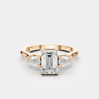 Bruton emerald cut pear side stone engagement ring in 18ct rose gold