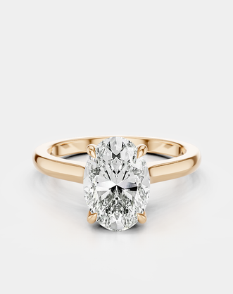 Montaigne oval solitaire swept shoulder engagement ring in 18ct rose gold