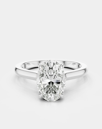 Montaigne oval solitaire swept shoulder engagement ring in 18ct white gold