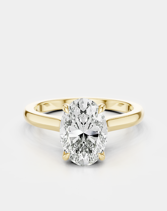 Montaigne oval solitaire swept shoulder engagement ring in 18ct yellow gold