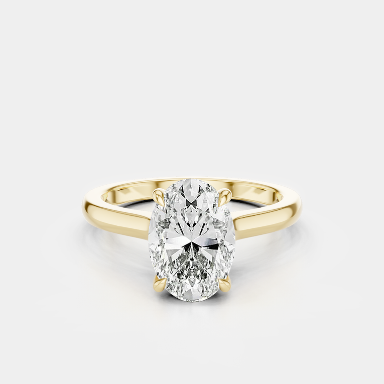 Montaigne oval solitaire swept shoulder engagement ring in 18ct yellow gold
