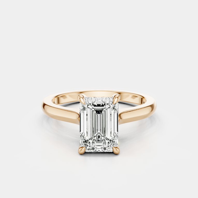 Dover emerald cut solitaire swept shoulder engagement ring in 18ct rose gold