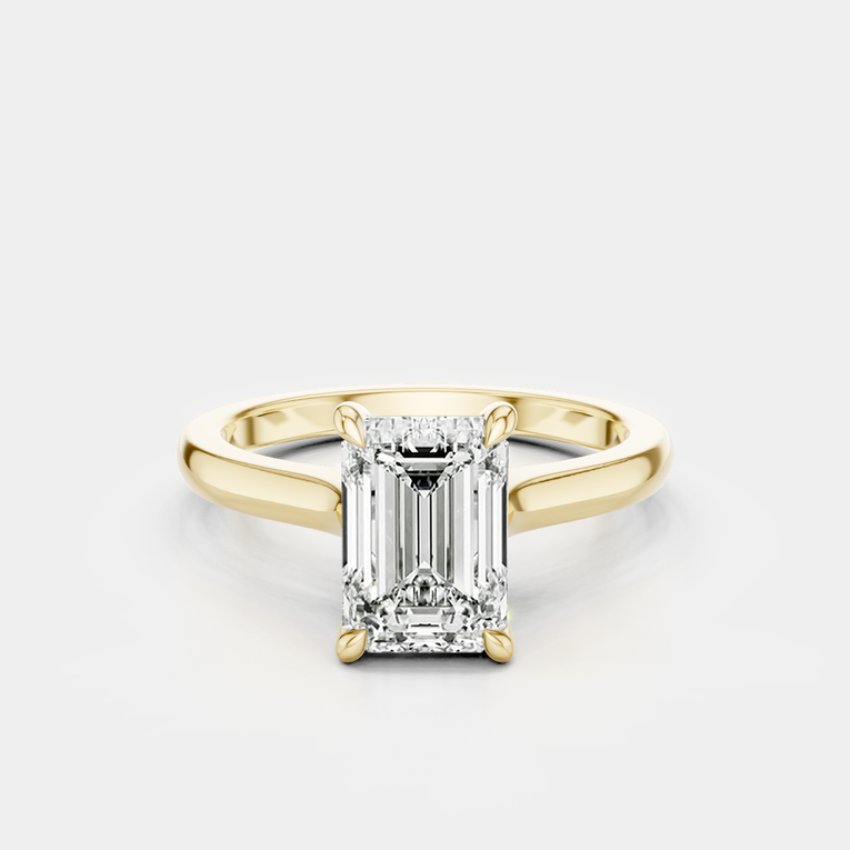 Dover emerald cut solitaire swept shoulder engagement ring in 18ct yellow gold