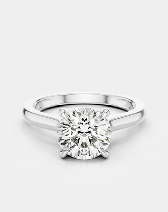 Sloane round brilliant four claw solitaire swept shoulder engagement ring in 18ct white gold