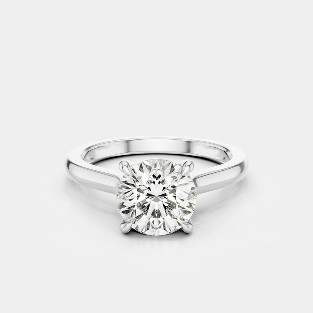 Sloane round brilliant four claw solitaire swept shoulder engagement ring in 18ct white gold