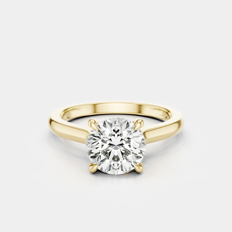 Sloane round brilliant four claw solitaire swept shoulder engagement ring in 18ct yellow gold