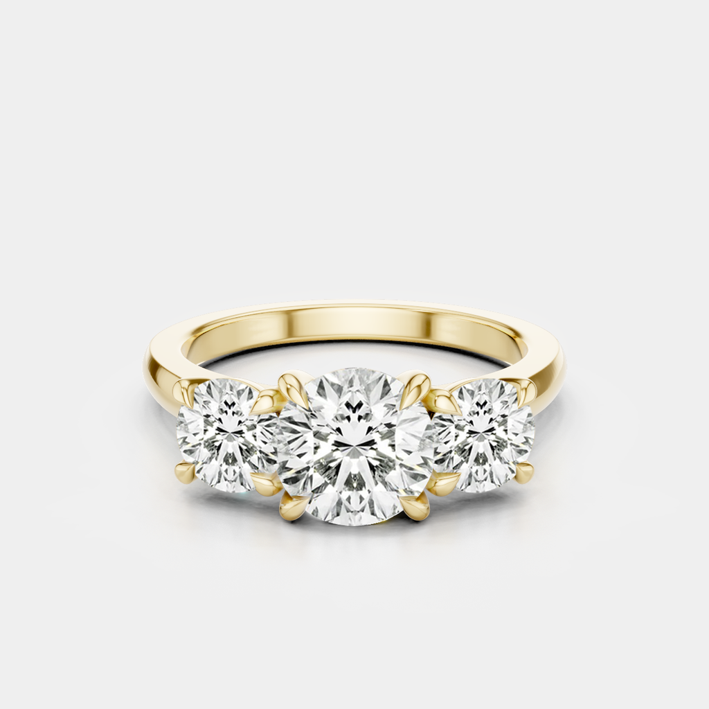 Kent round brilliant trilogy engagement ring in 18ct yellow gold 