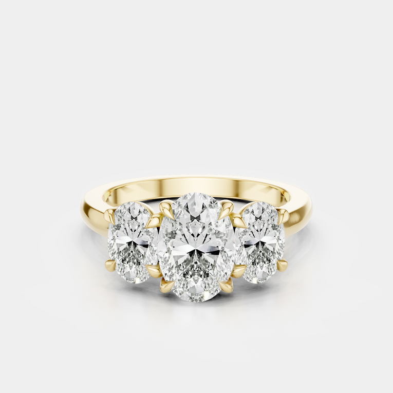 Clarkson oval trilogy engagement ring in 18ct yellow gold