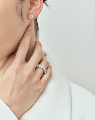 Model wears Kensington 1ct heart shape diamond studs in 18ct white gold