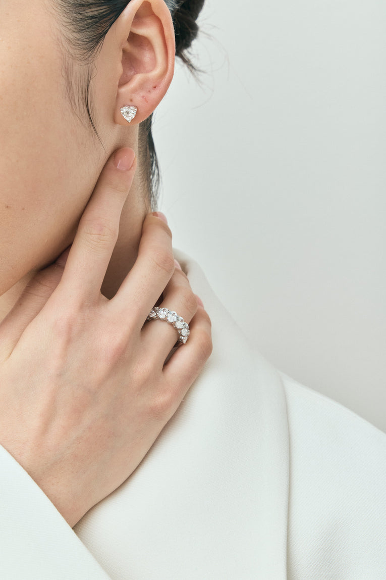 Model wears Kensington 1ct heart shape diamond studs in 18ct white gold