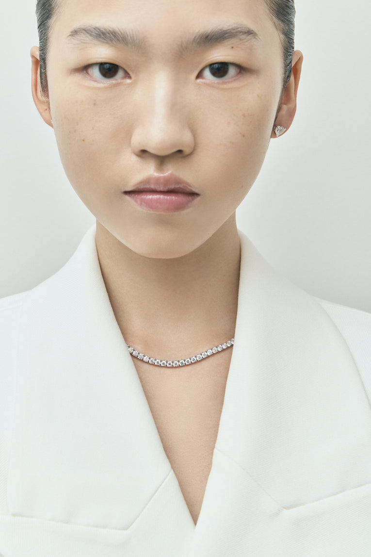 Model wearing Lucile round brilliant claw set tennis necklace 20ct