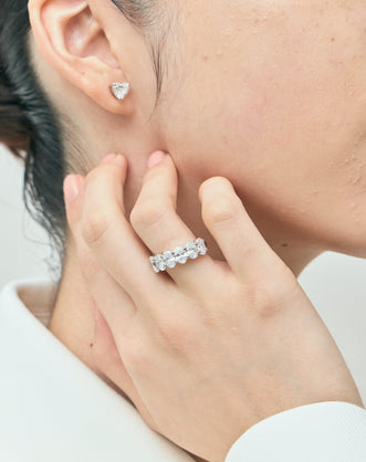 Model wears Kensington 1ct heart shape diamond studs in 18ct white gold